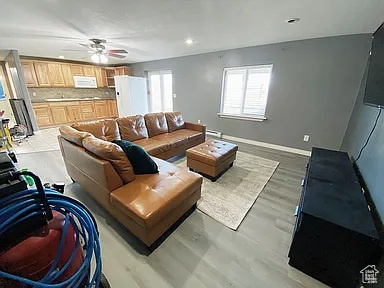 Living area featuring ceiling fan, recessed lighting, and light wood finished floors