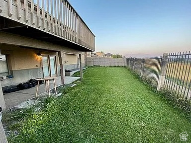 View of fenced backyard