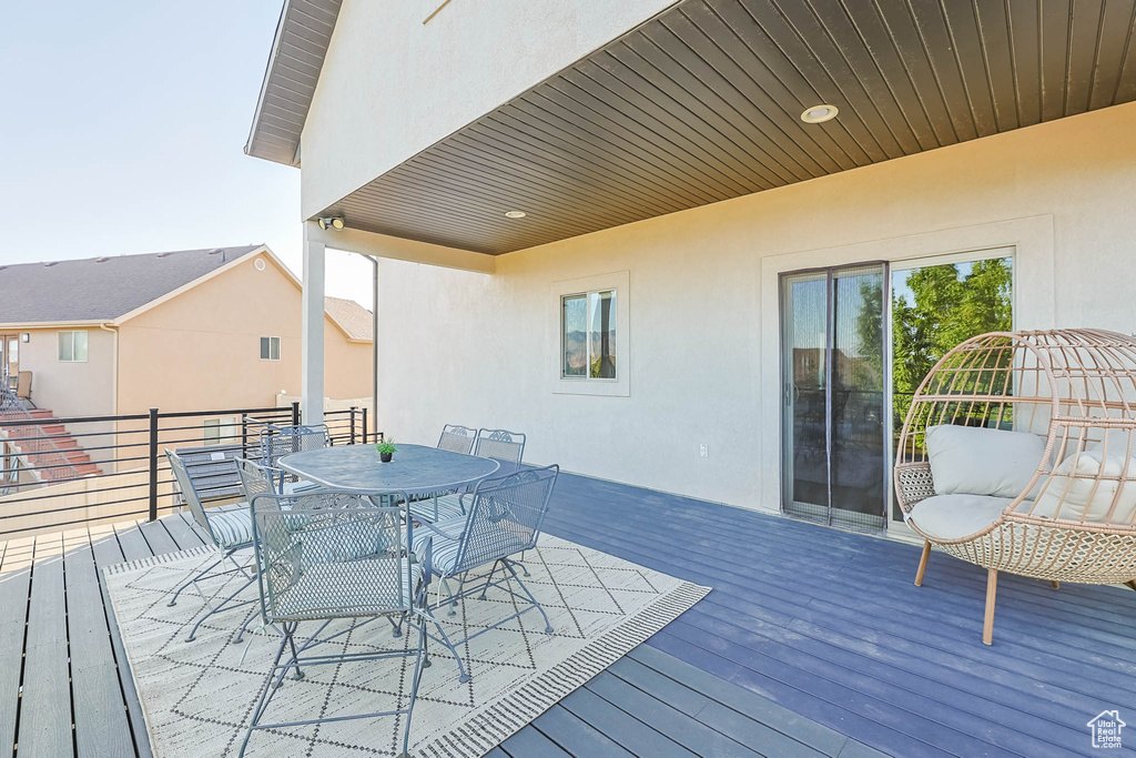 Wooden terrace featuring outdoor dining space