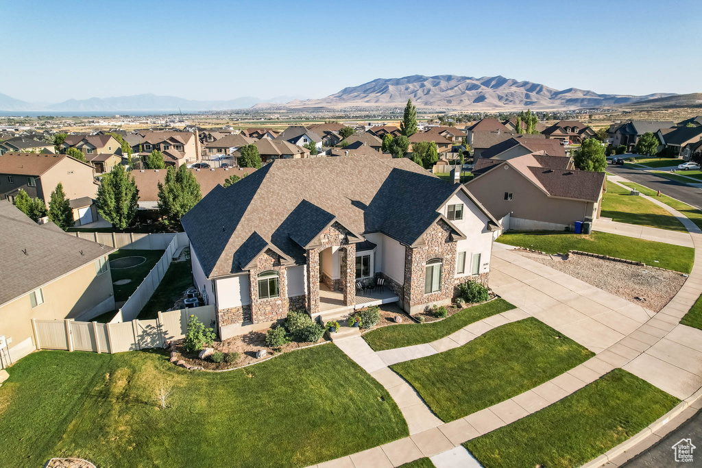 Aerial perspective of suburban area with a mountain backdrop