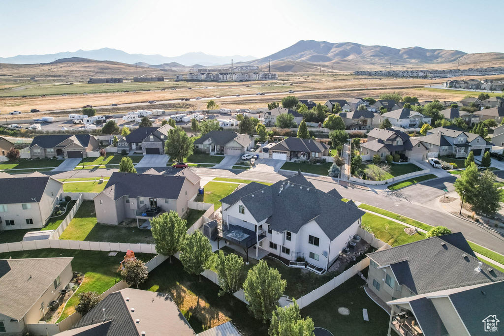 Aerial perspective of suburban area with a mountainous background