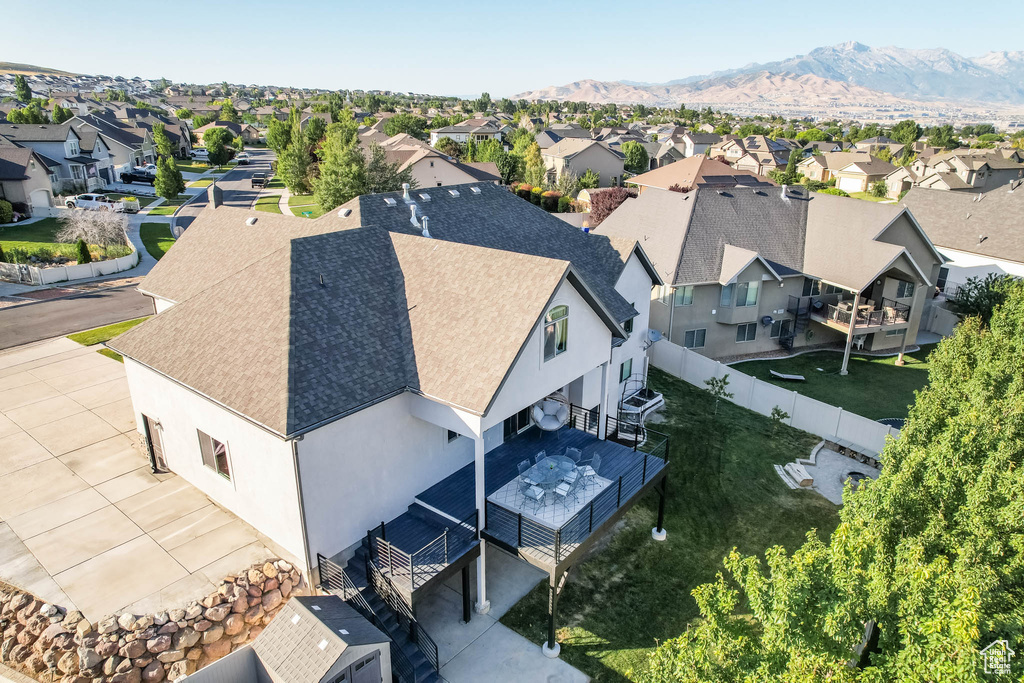 Aerial perspective of suburban area featuring a mountain backdrop