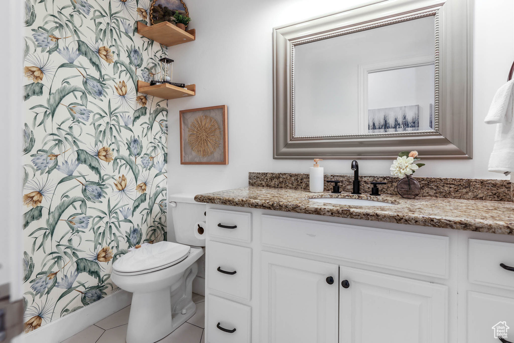 Full bath featuring vanity and tile patterned floors