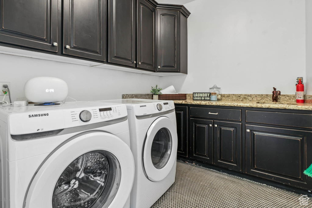 Laundry room with cabinet space and separate washer and dryer