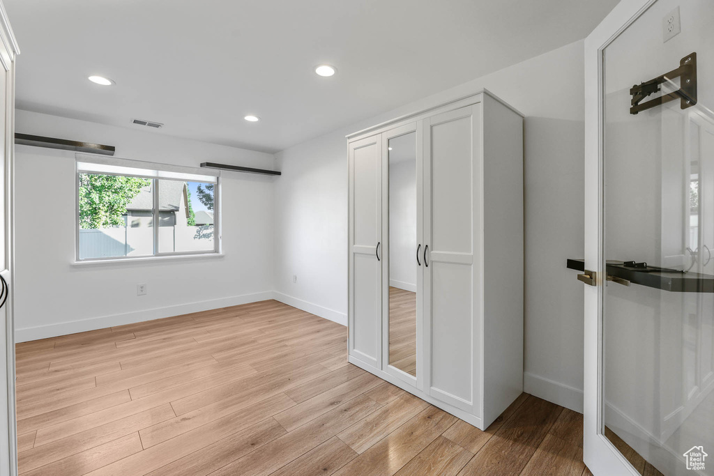 Unfurnished bedroom featuring light wood-style flooring and recessed lighting