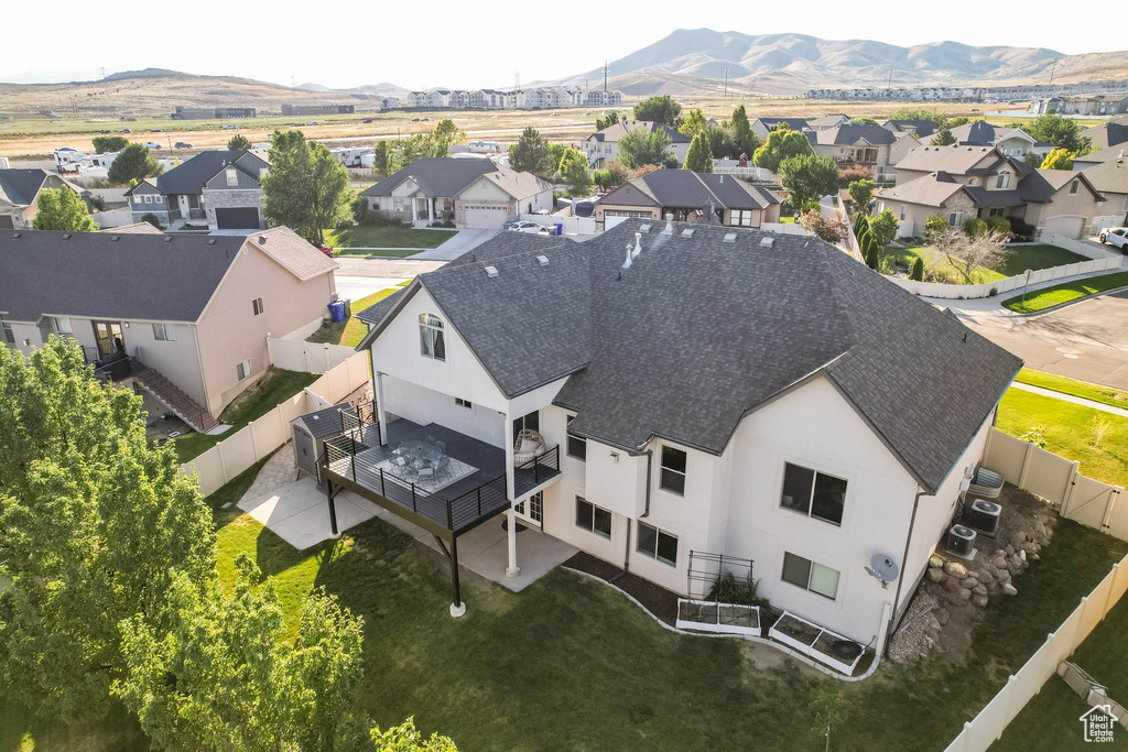 Aerial perspective of suburban area featuring a mountainous background