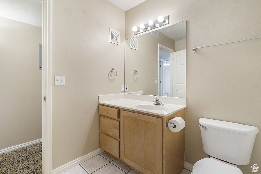 Bathroom with vanity and tile patterned flooring