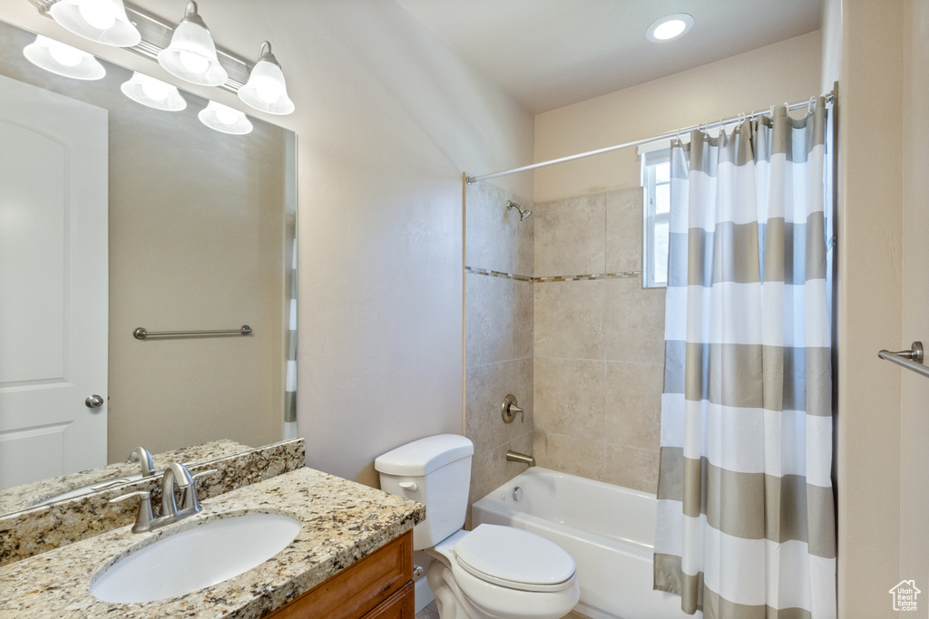 Full bath featuring vanity and shower / bath combo