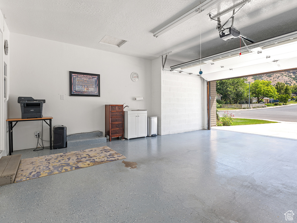 Garage featuring a garage door opener