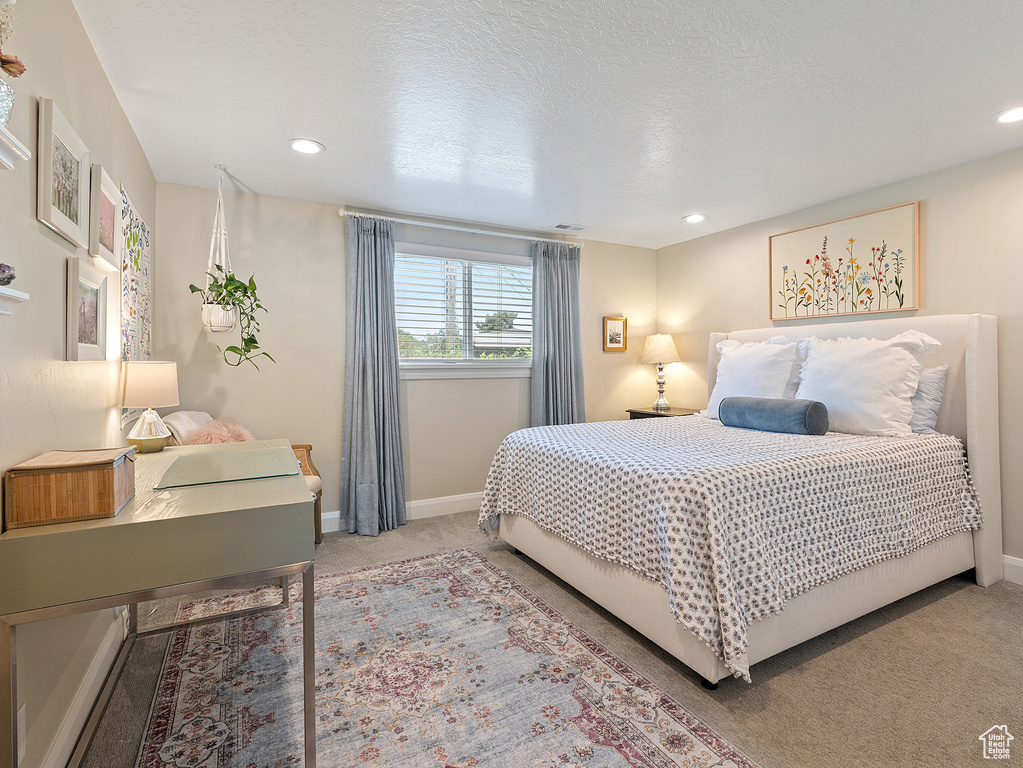 Carpeted bedroom featuring recessed lighting