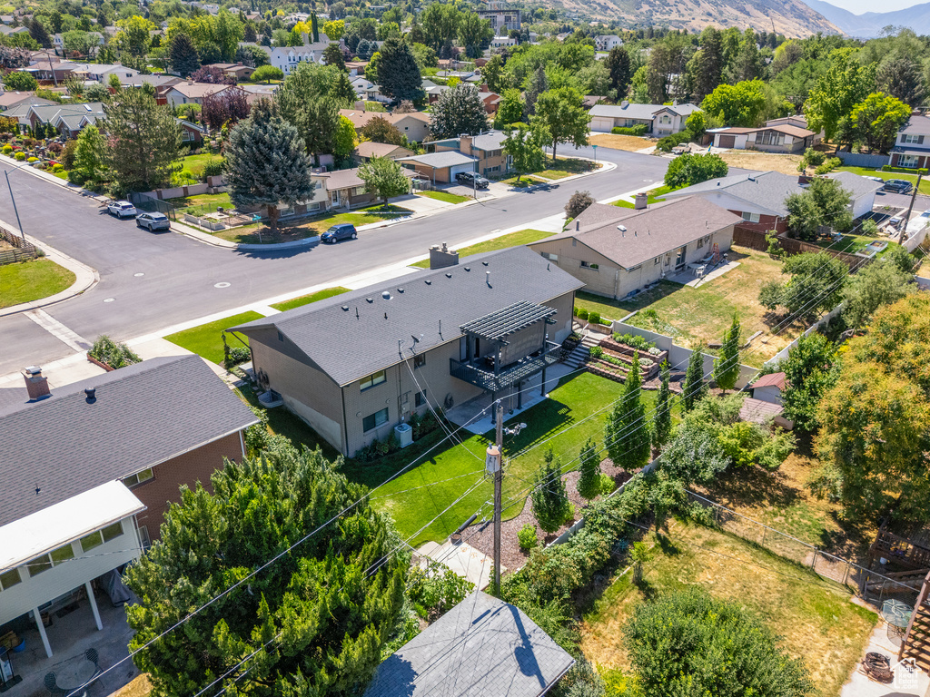 Aerial perspective of suburban area with a mountainous background