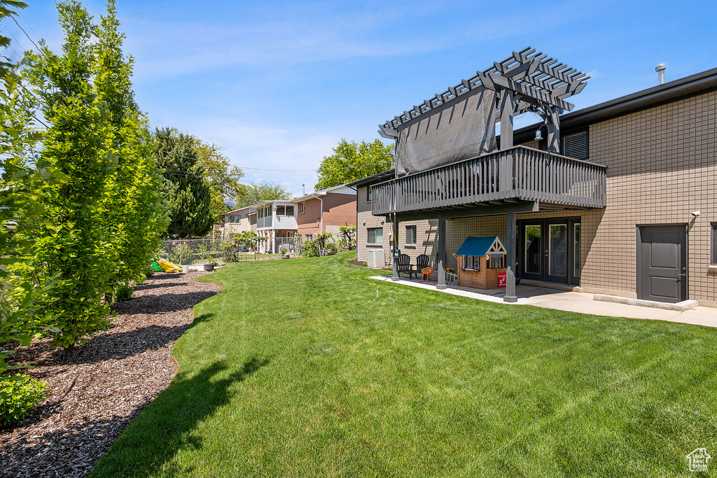 View of yard with a patio area and a pergola