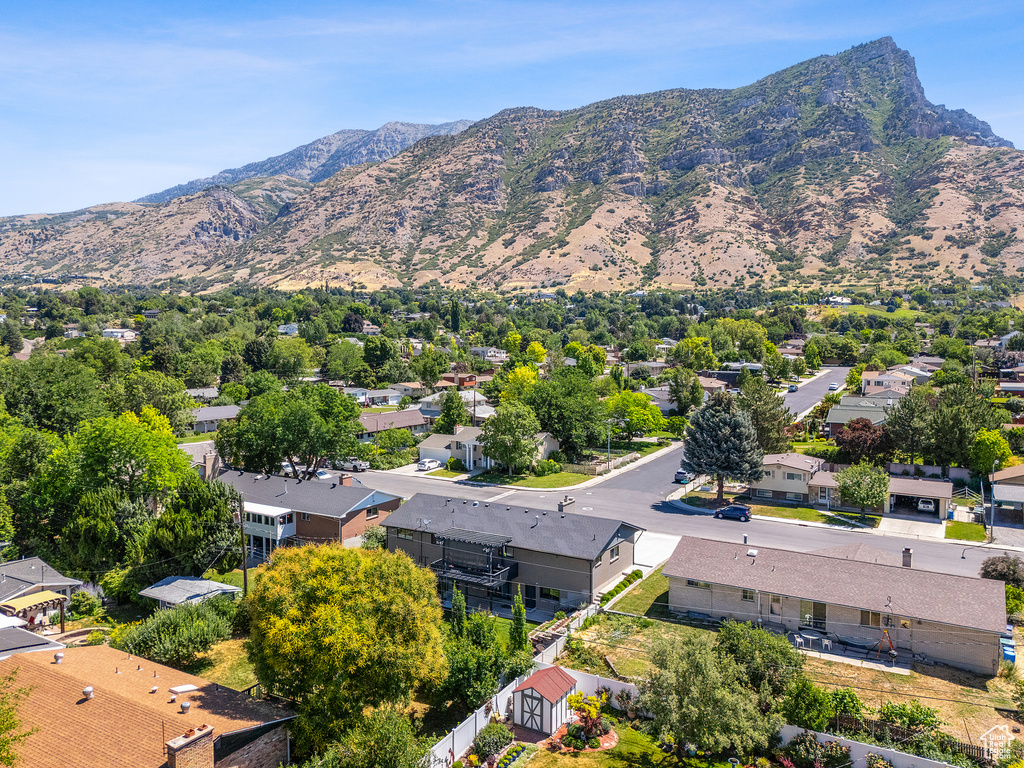 View of mountain backdrop featuring nearby suburban area