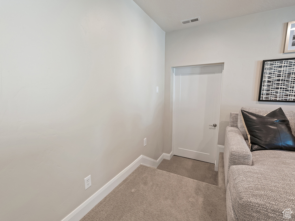 Carpeted bedroom with baseboards