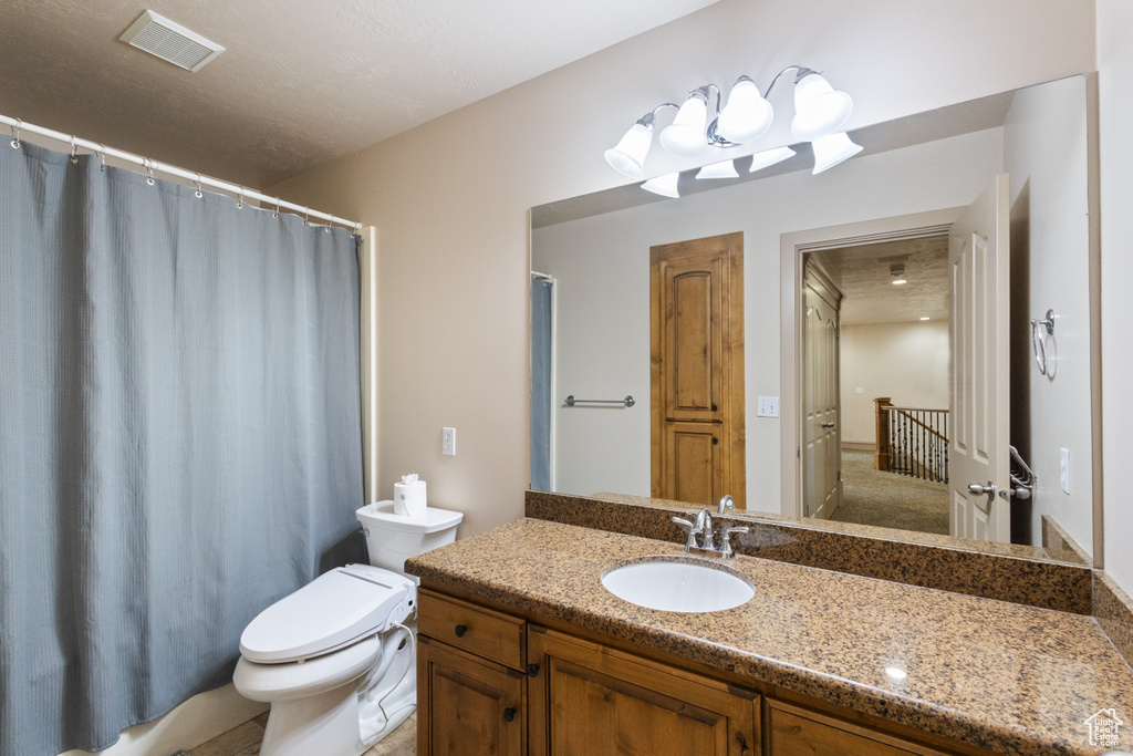 Bathroom featuring vanity and a shower with curtain