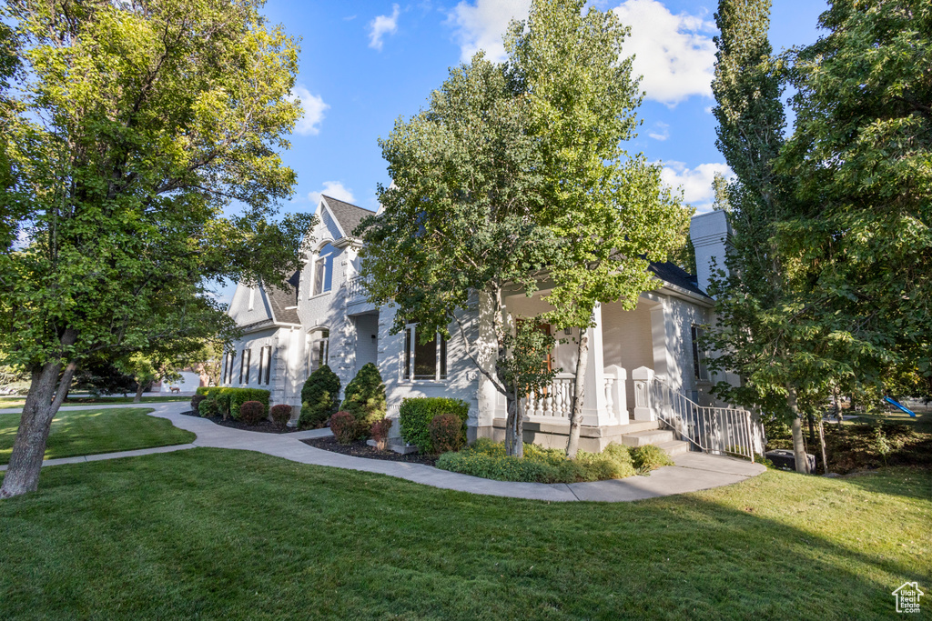 View of side of home with a lawn