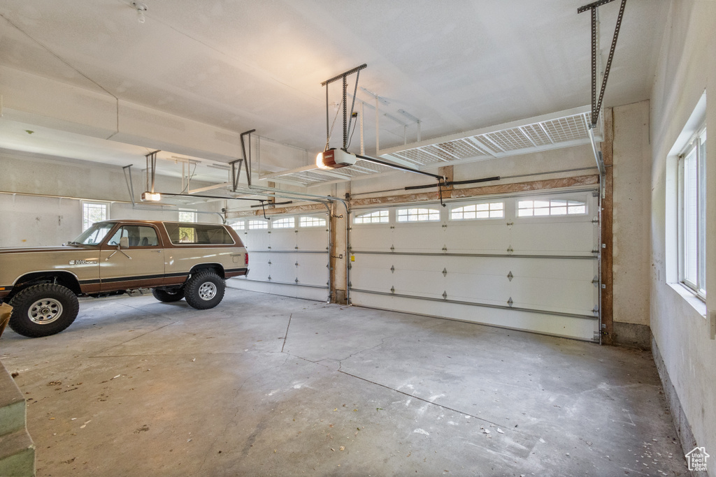 Garage featuring a garage door opener