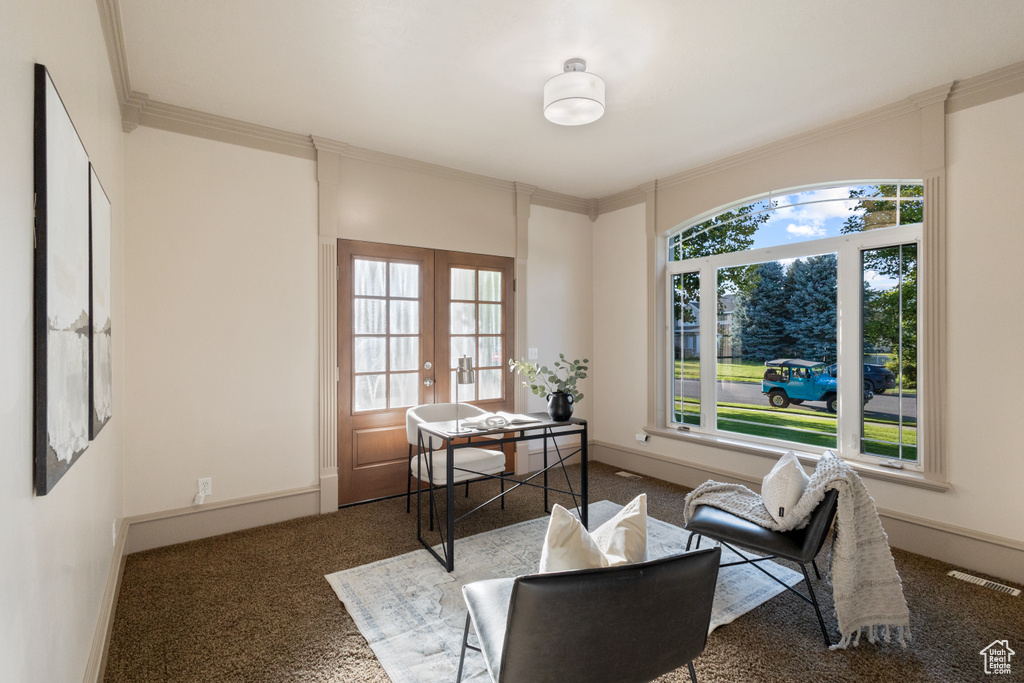 Sitting room featuring carpet, french doors, and crown molding