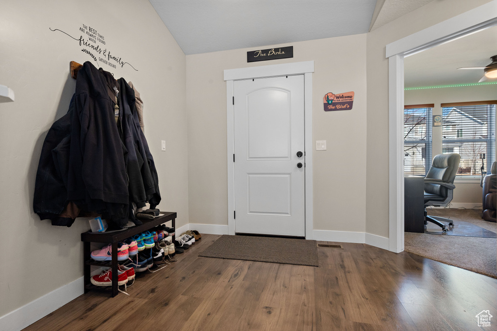 Foyer with wood finished floors, lofted ceiling, and a ceiling fan