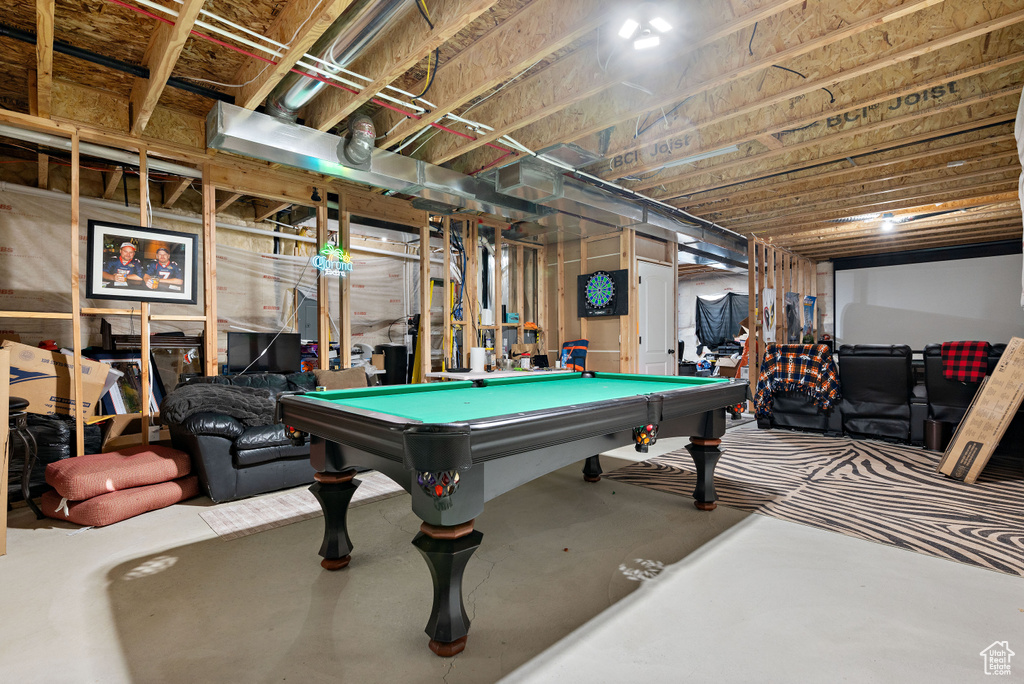 Game room with concrete flooring and pool table