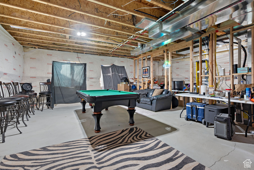 Playroom featuring finished concrete flooring and billiards
