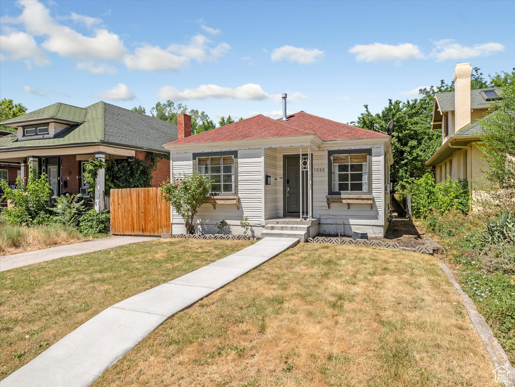 Bungalow featuring a chimney