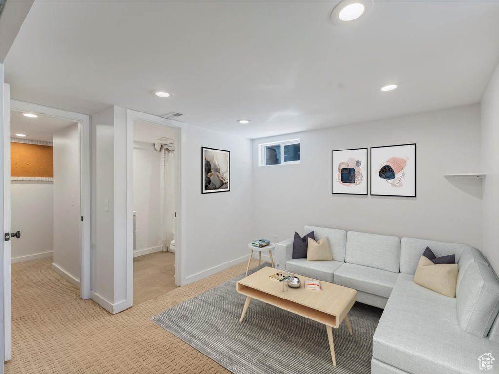 Living room with light carpet and recessed lighting