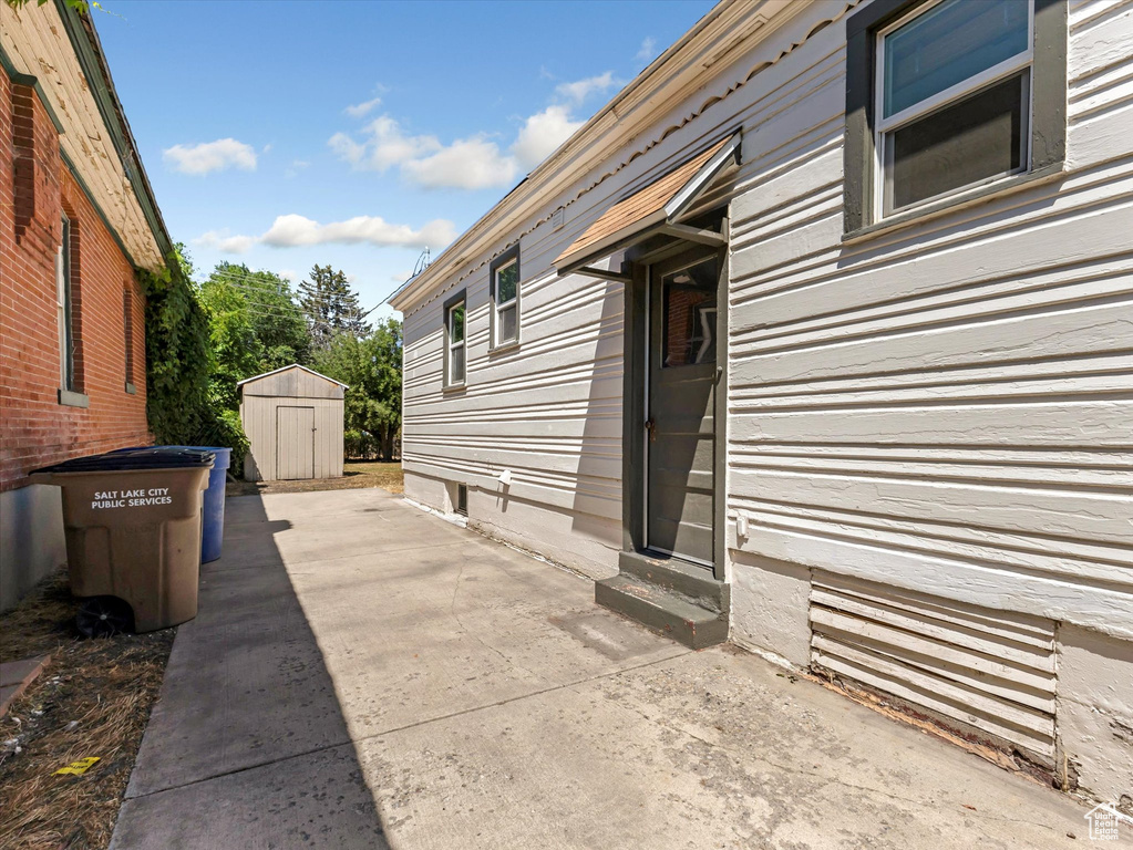 View of patio / terrace featuring a storage shed and entry steps