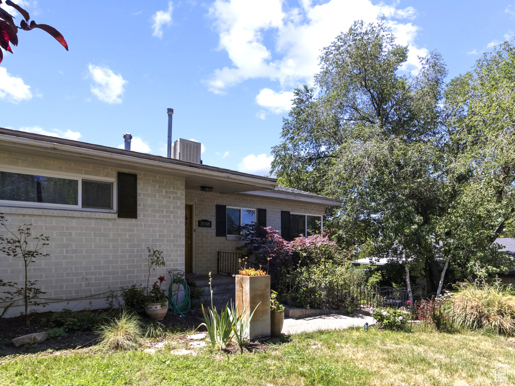 View of front facade featuring brick siding