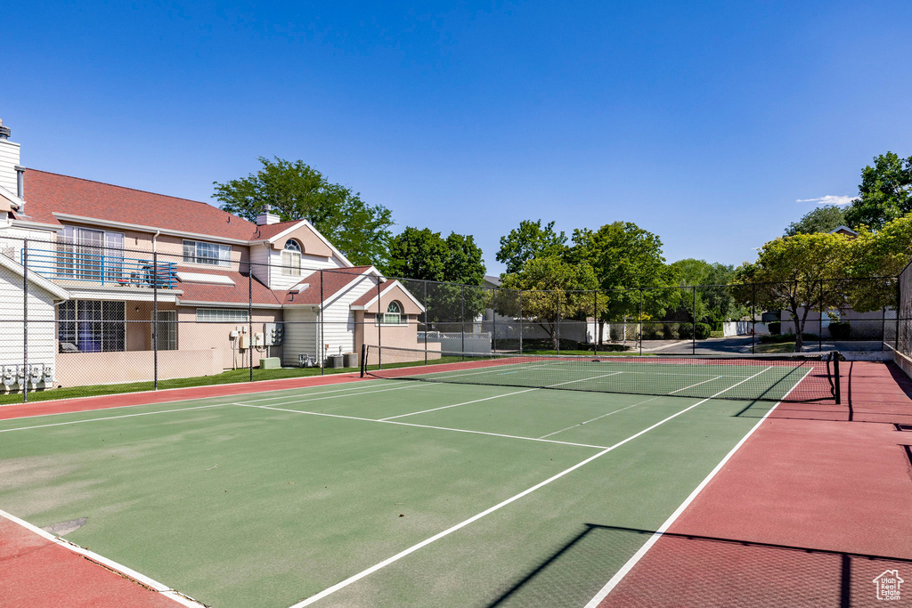 View of tennis court with community basketball court