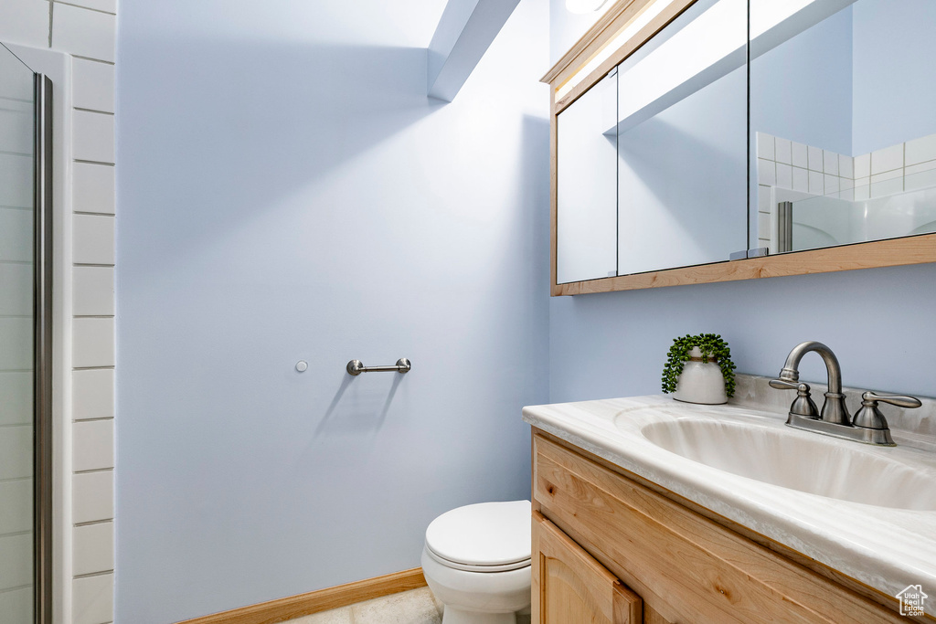Bathroom with vanity and toilet