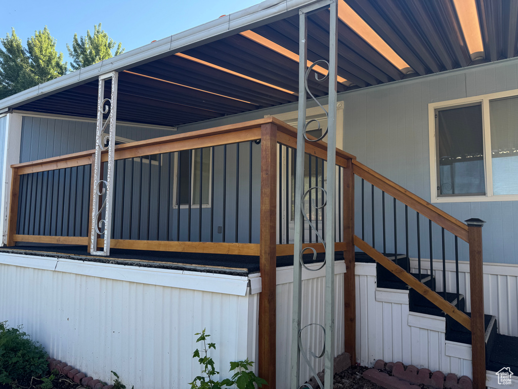 View of side of home with stairs