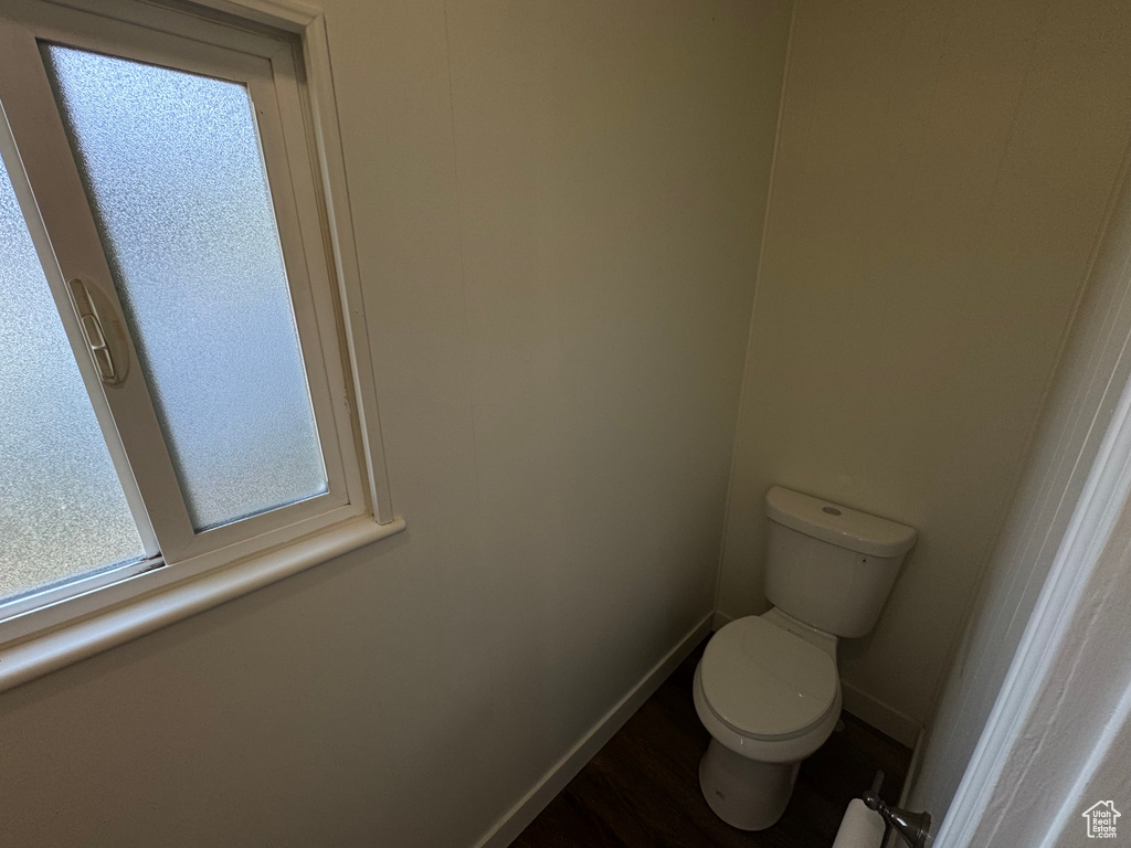 Bathroom featuring toilet and baseboards