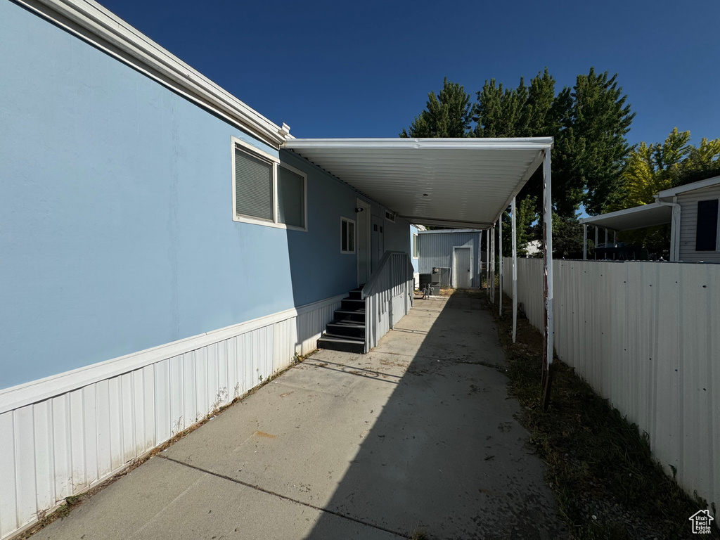 View of side of property featuring a carport