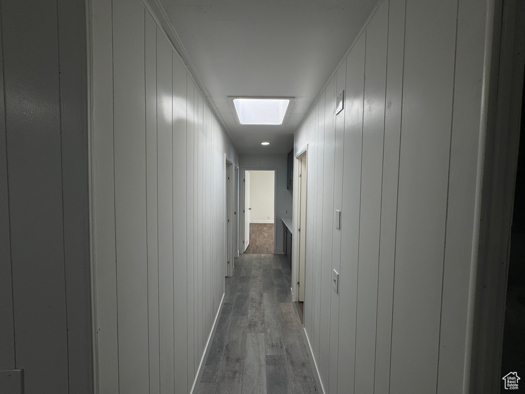 Hallway featuring dark wood finished floors