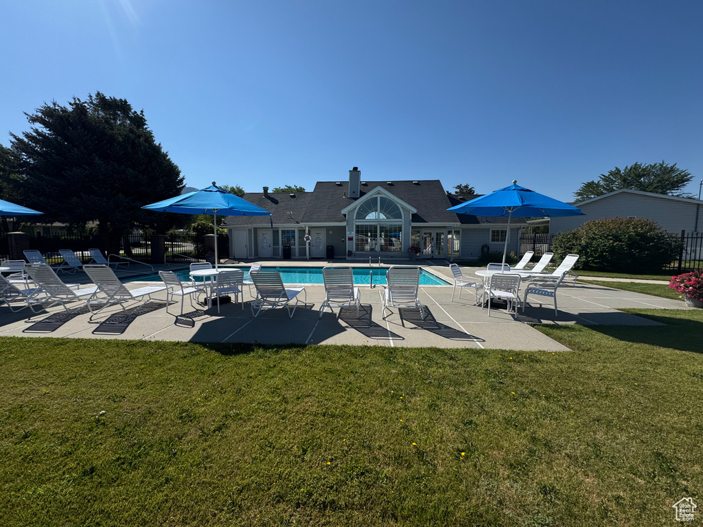 Community pool with a patio area
