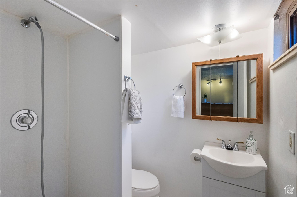Full bathroom with vanity and a shower