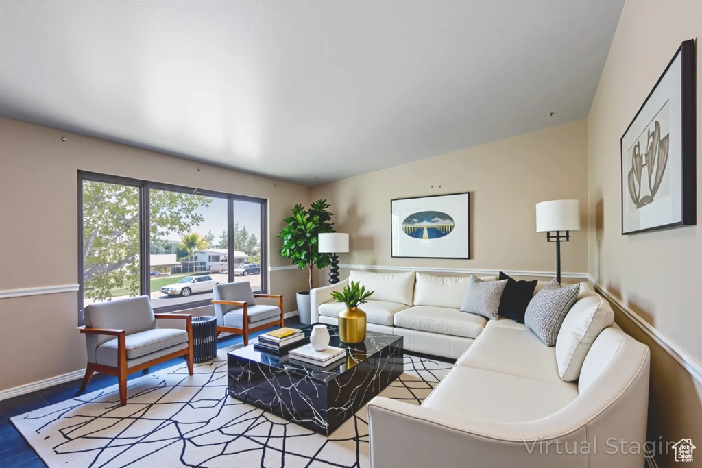 Living room with baseboards and wood finished floors