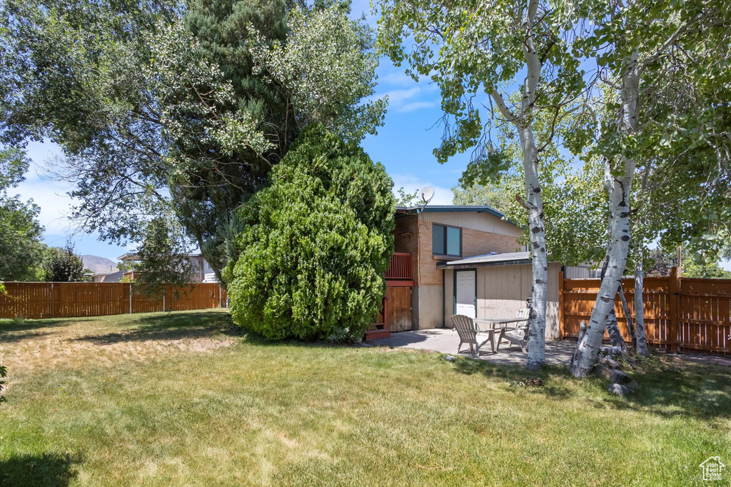 Fenced backyard featuring a patio area