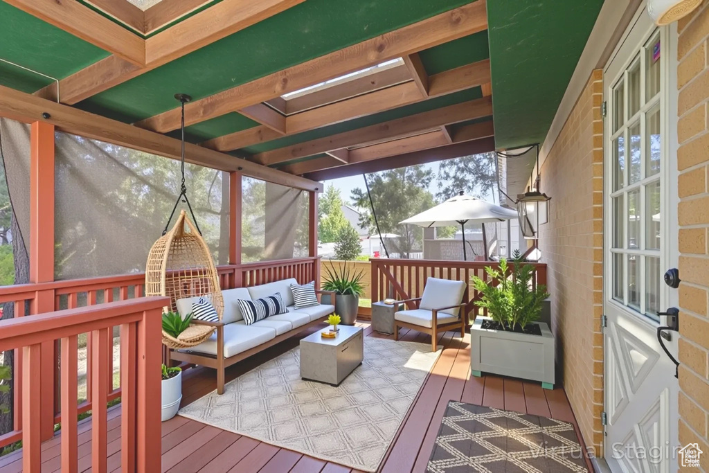 Wooden terrace featuring an outdoor hangout area