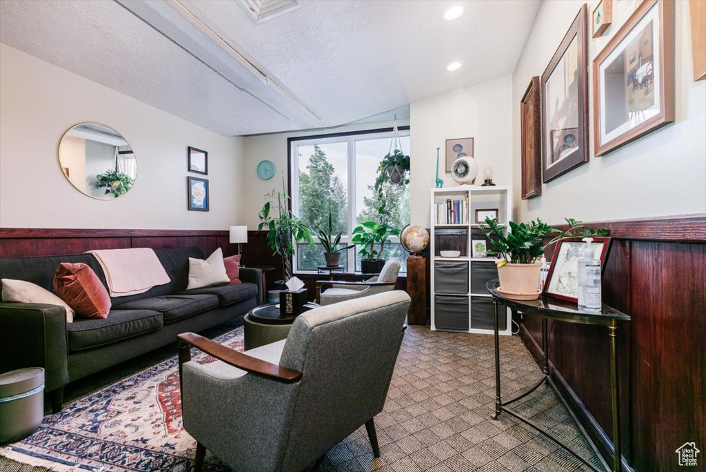 Living room with recessed lighting and a textured ceiling