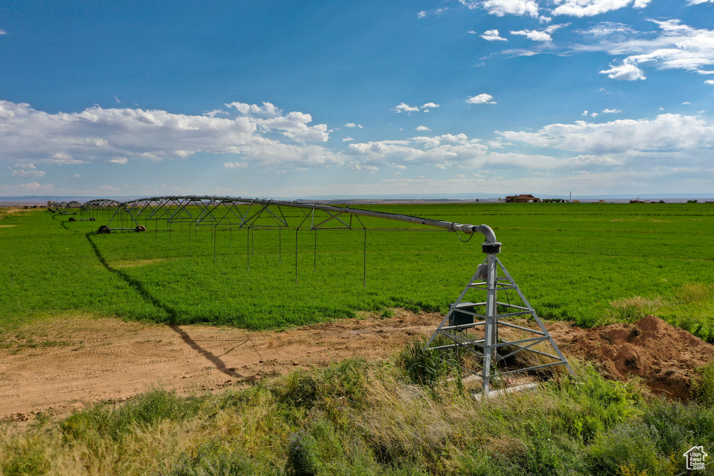 View of green lawn with a rural view