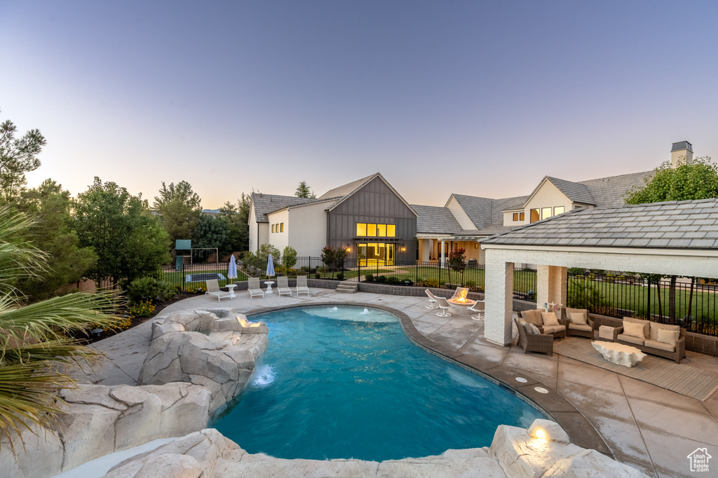 View of swimming pool featuring a patio and outdoor lounge area