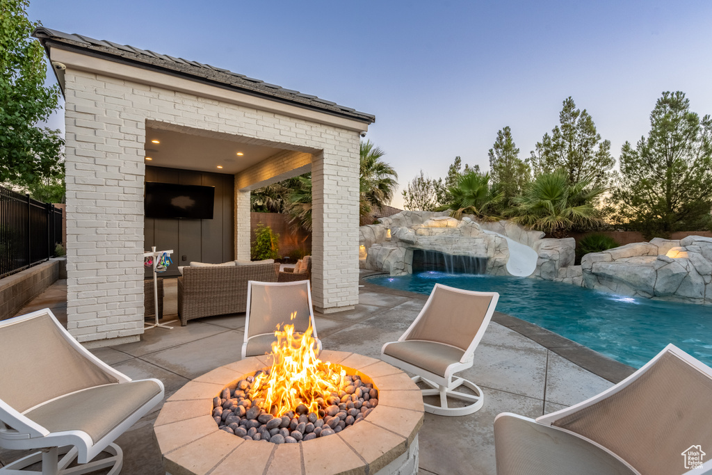 View of patio / terrace with an outdoor fire pit