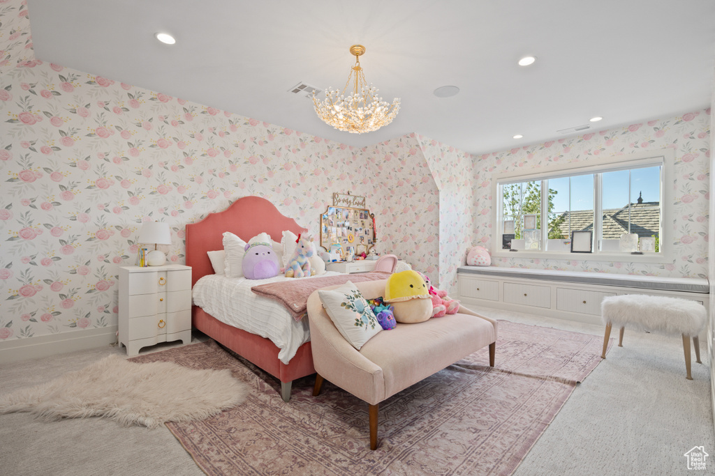 Bedroom with wallpapered walls, a chandelier, light colored carpet, and recessed lighting