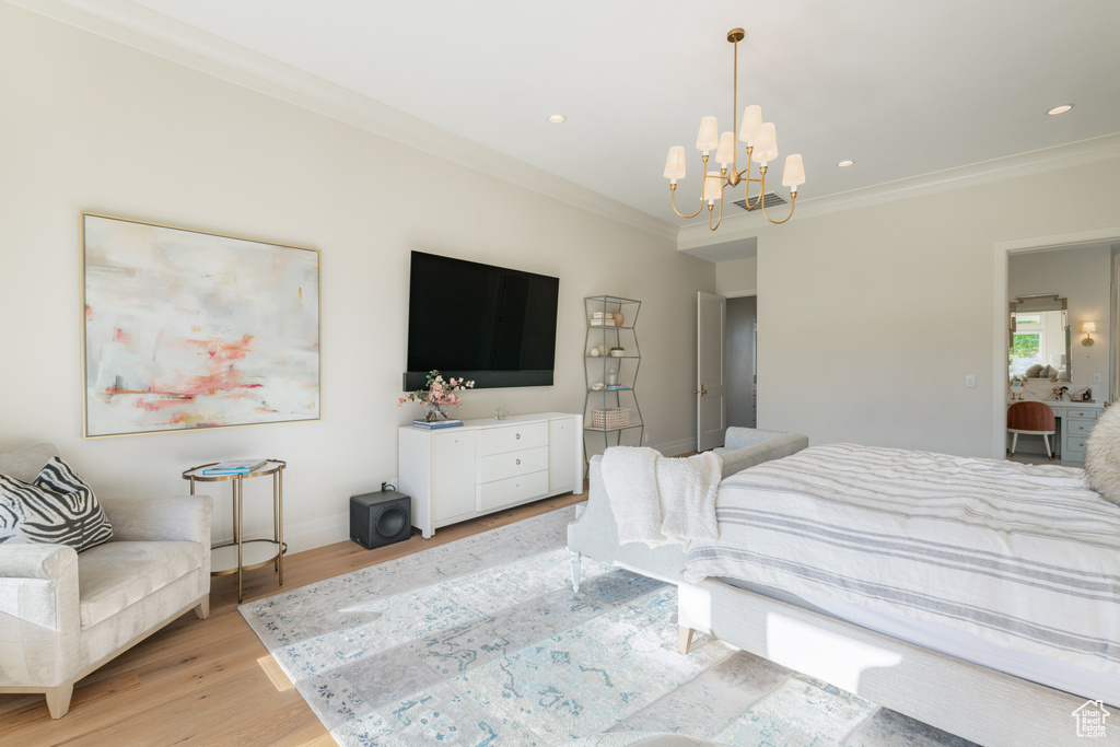 Bedroom featuring crown molding, a chandelier, light wood-style flooring, and recessed lighting