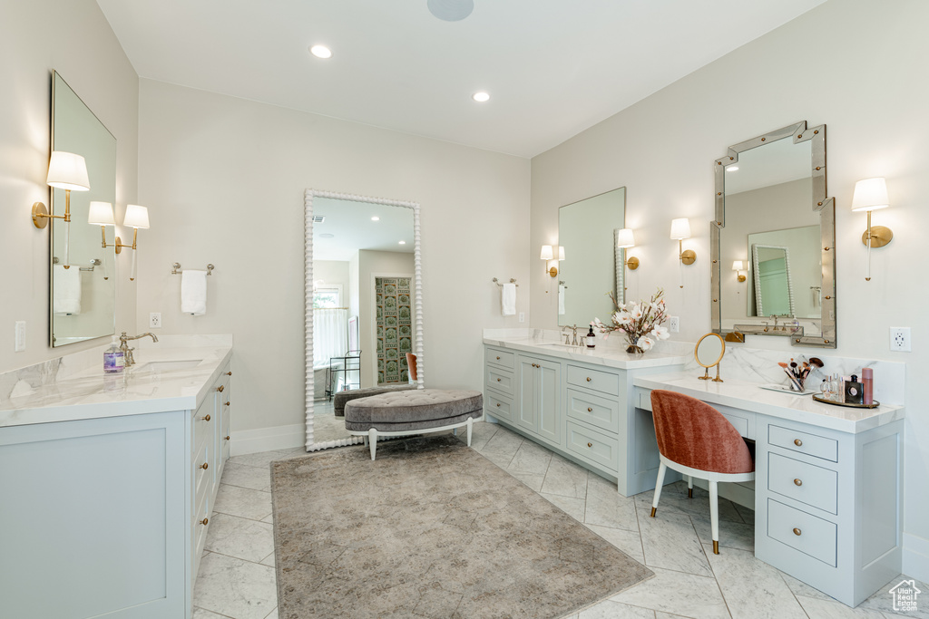 Full bath featuring two vanities and recessed lighting