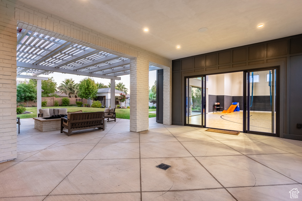 View of patio featuring a pergola and outdoor lounge area