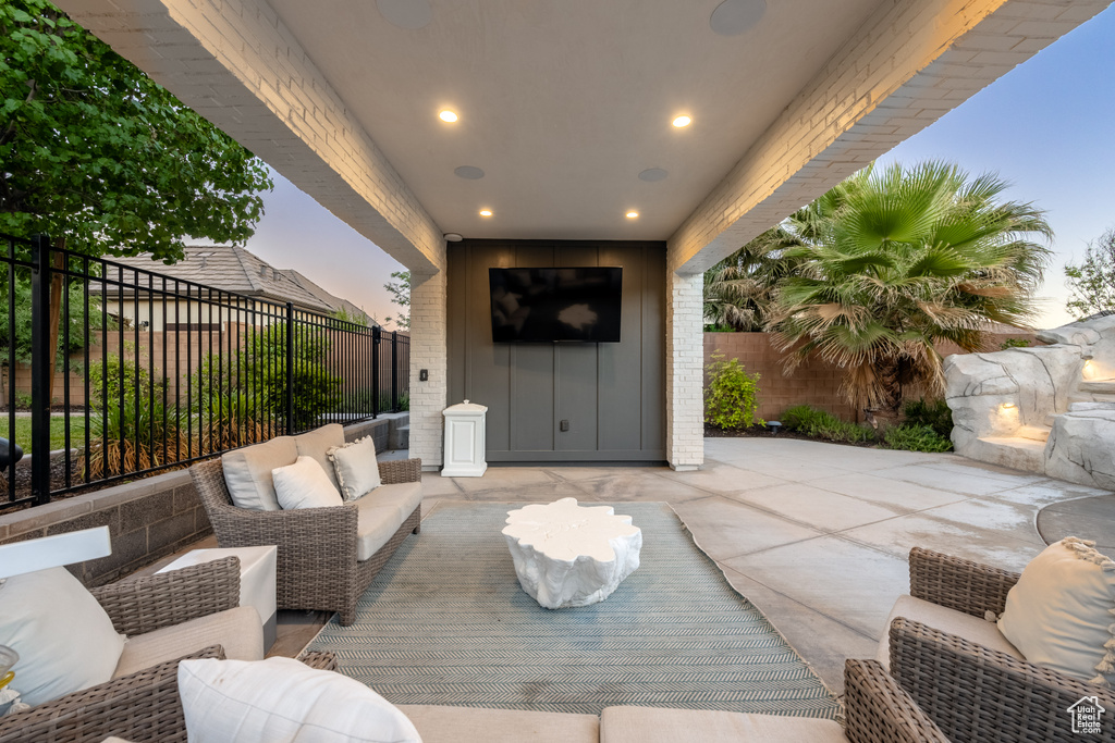 Fenced backyard featuring a patio area and outdoor lounge area