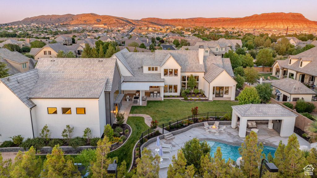 Aerial view of residential area featuring a mountain backdrop